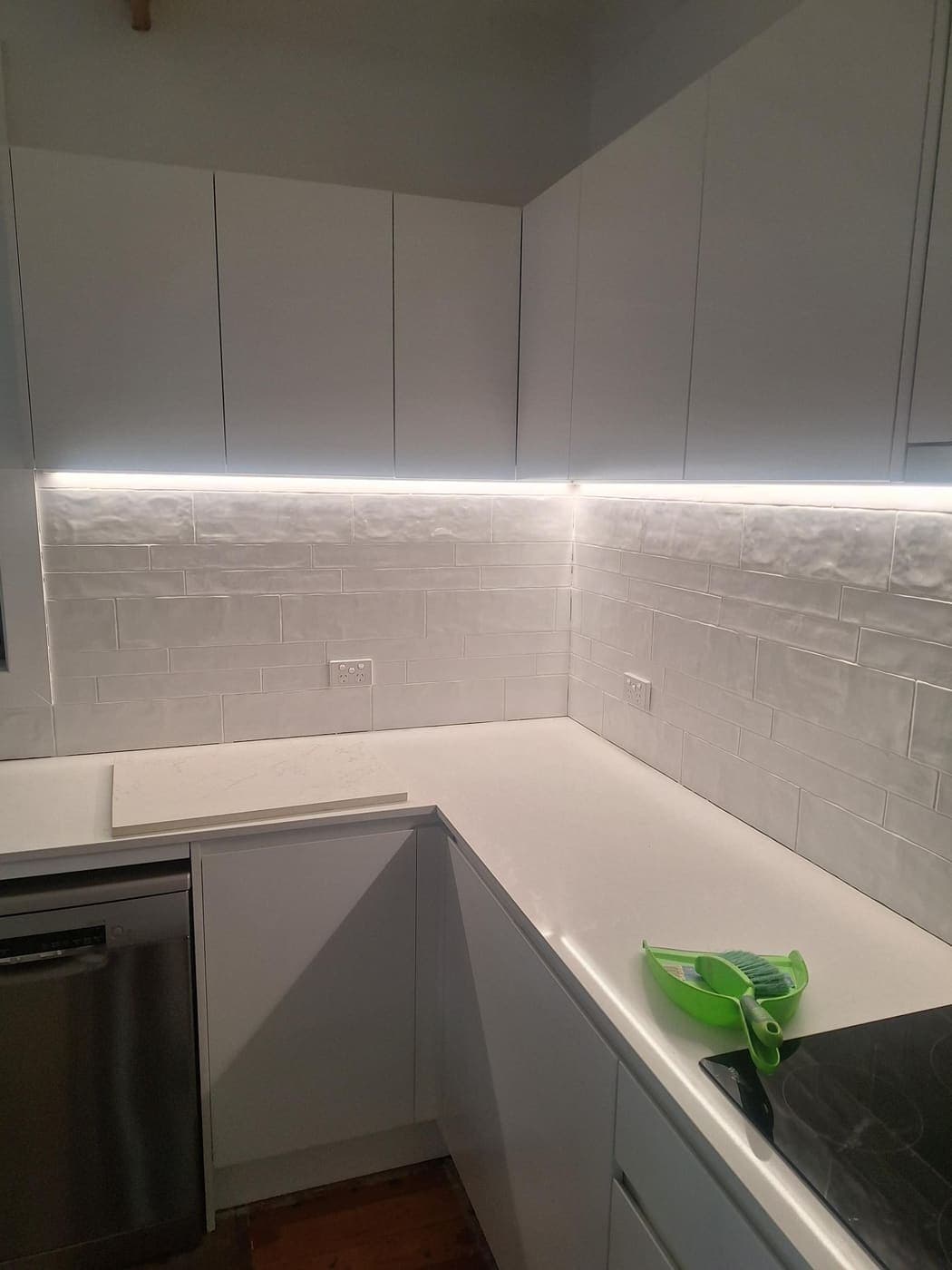 Kitchen with a grey subway-tile splashback and flush-mounted power points
