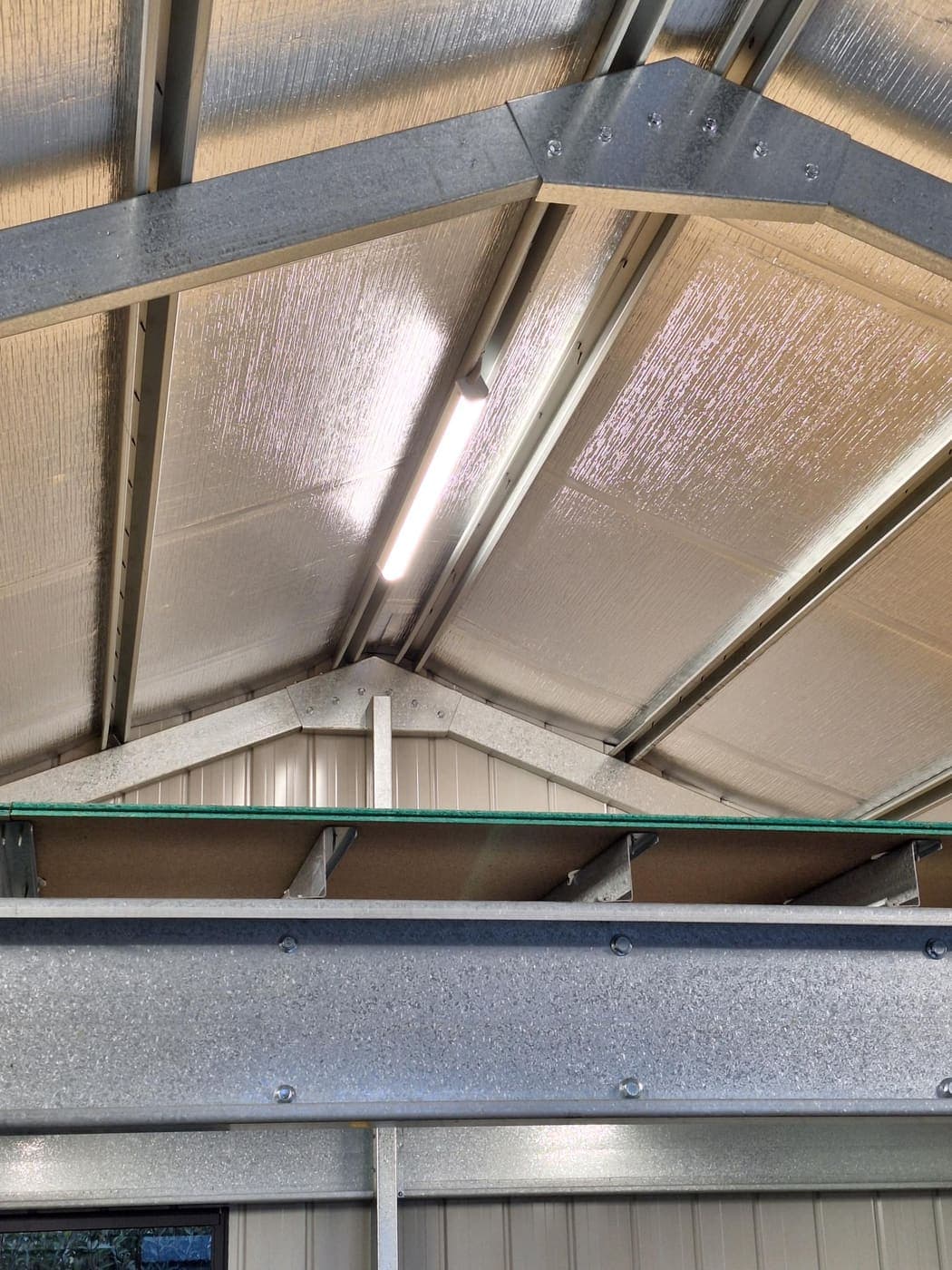 LED batten light installed on a steel-framed shed ceiling