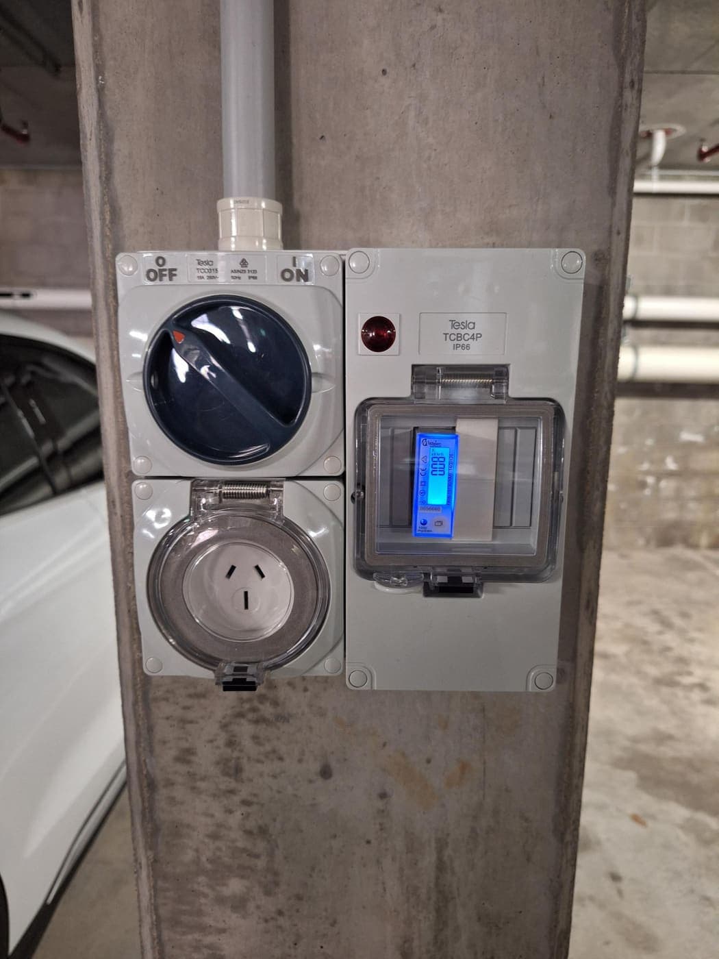 Tesla EV charger circuit with isolator and metering in a basement car park