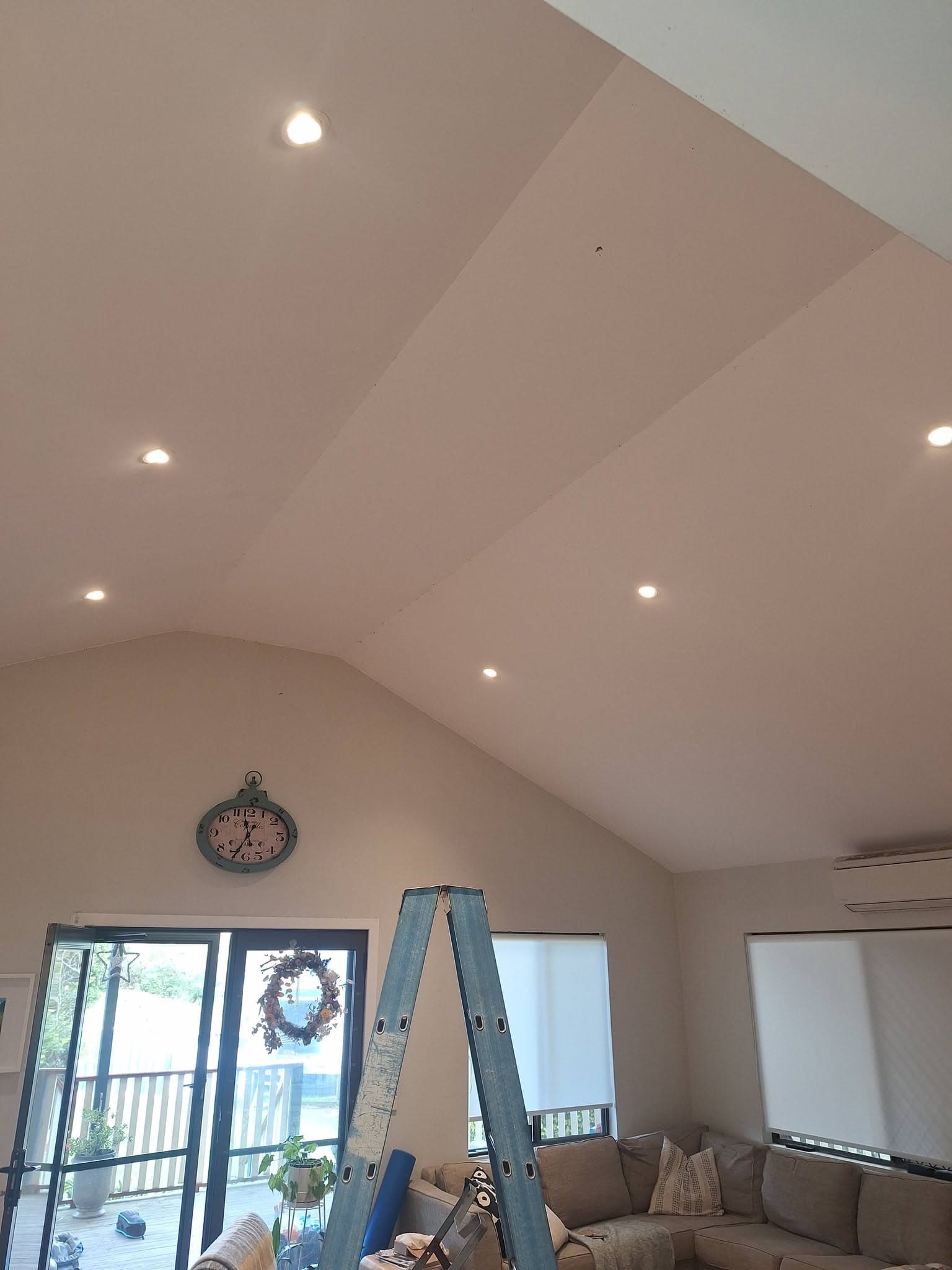 New LED downlights in a raked living-room ceiling