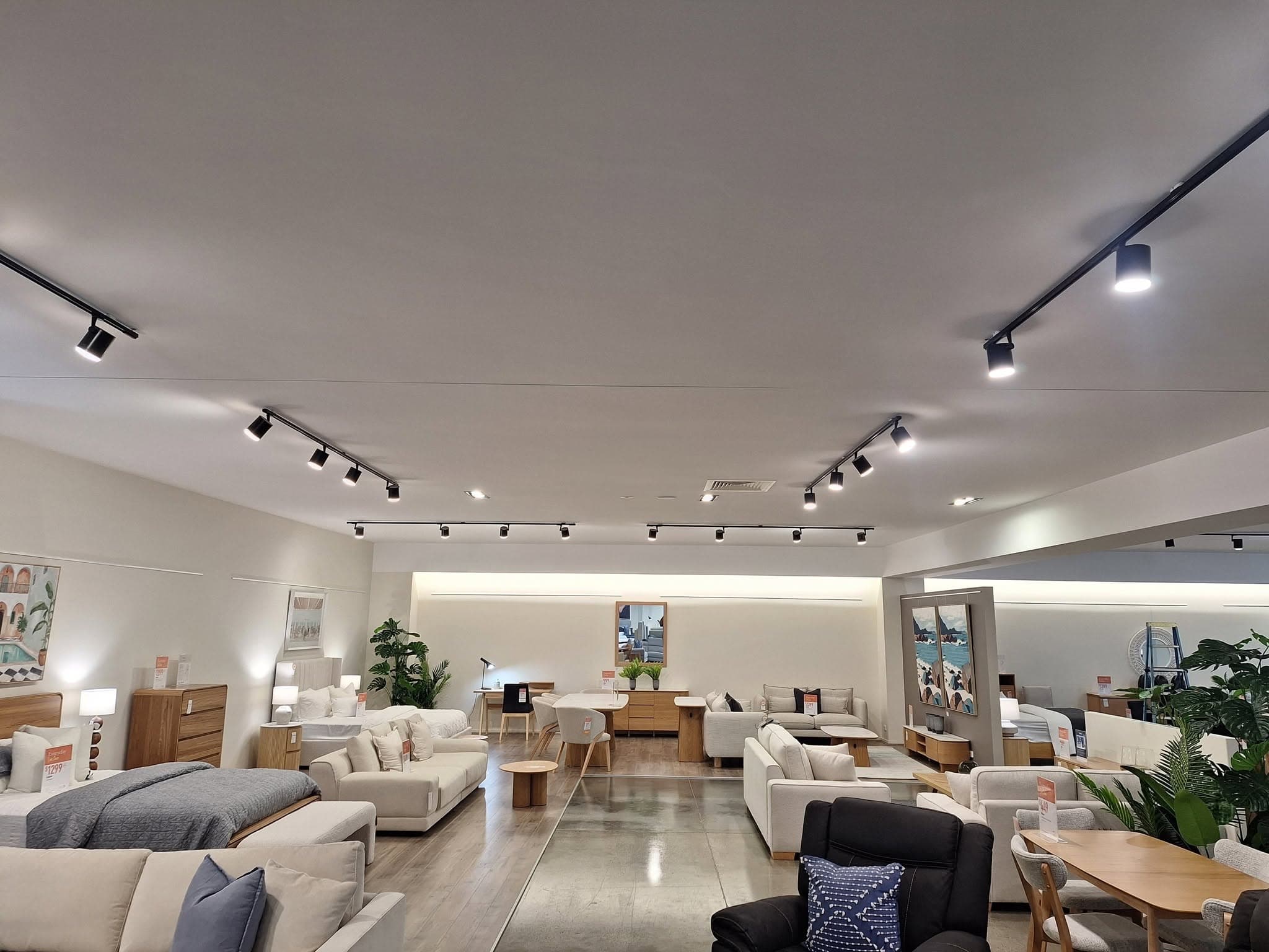 Furniture showroom lit with black track lighting