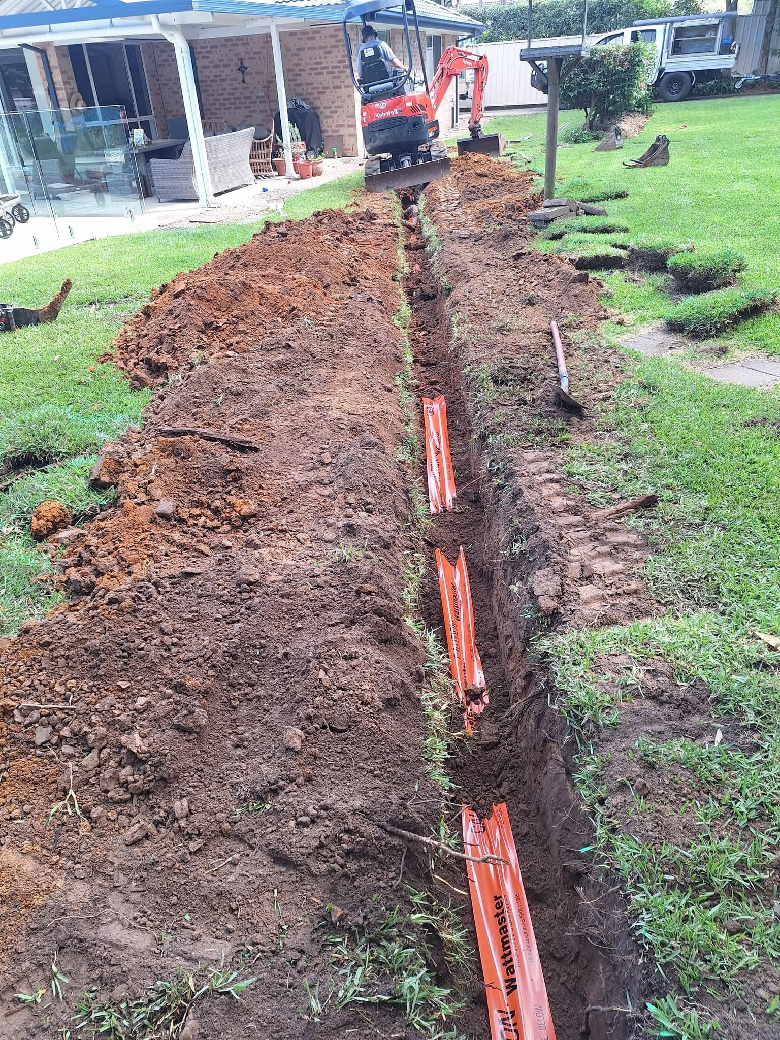 In-ground cabling trench dug for outdoor lighting and power