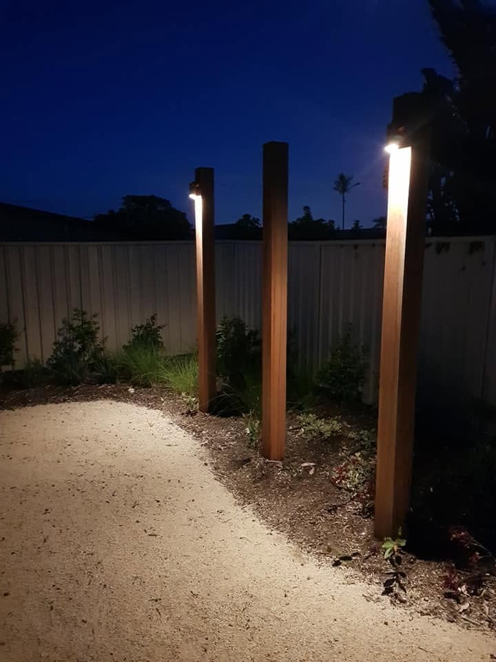 Garden path and landscape lighting glowing at dusk
