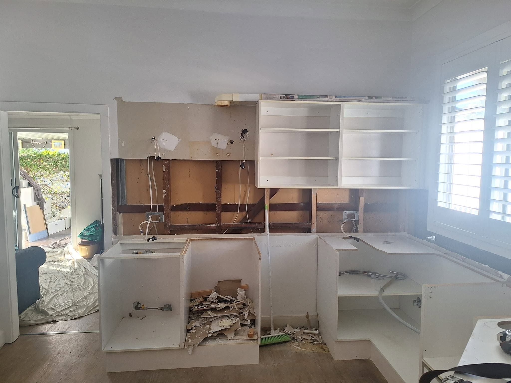 Kitchen mid-renovation with rough-in wiring exposed